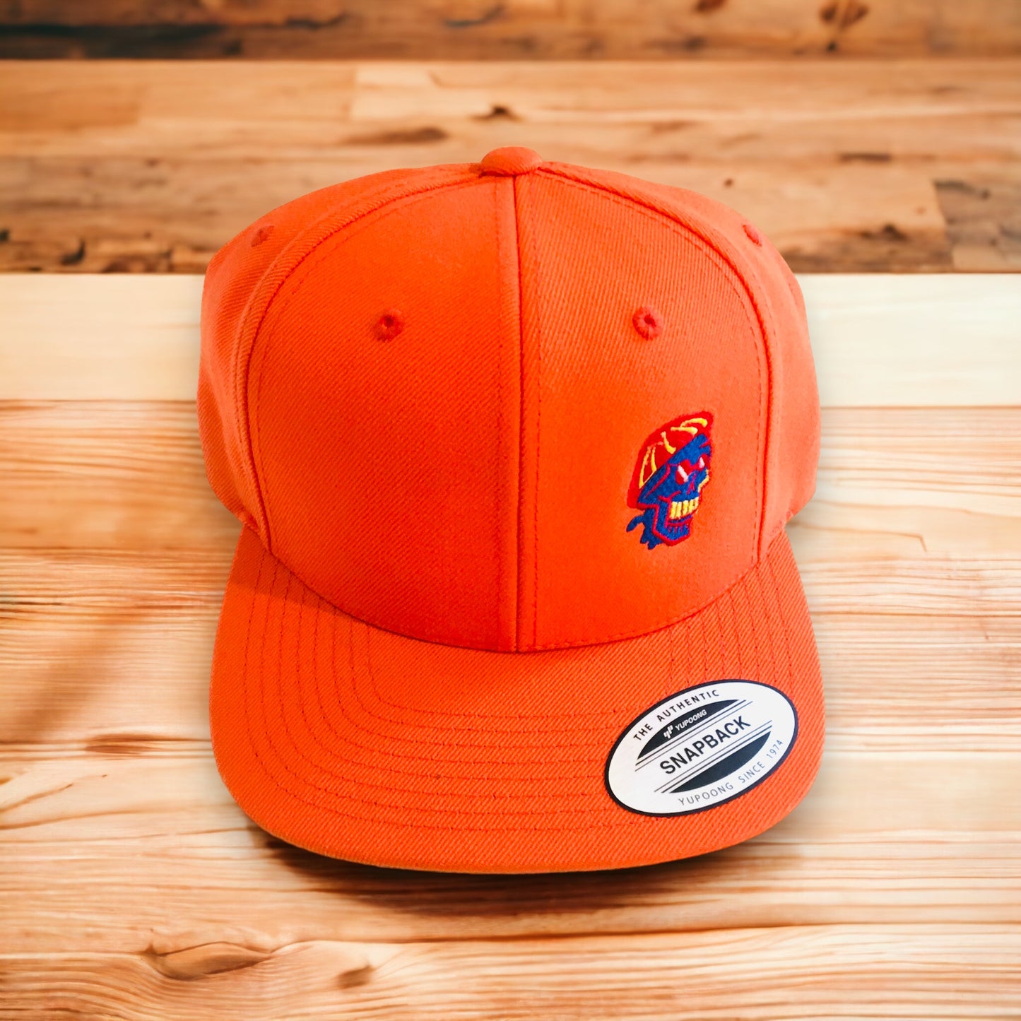 Orange flatpeak cap