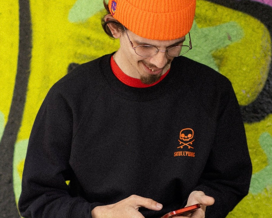 Sku black sweater orange logos